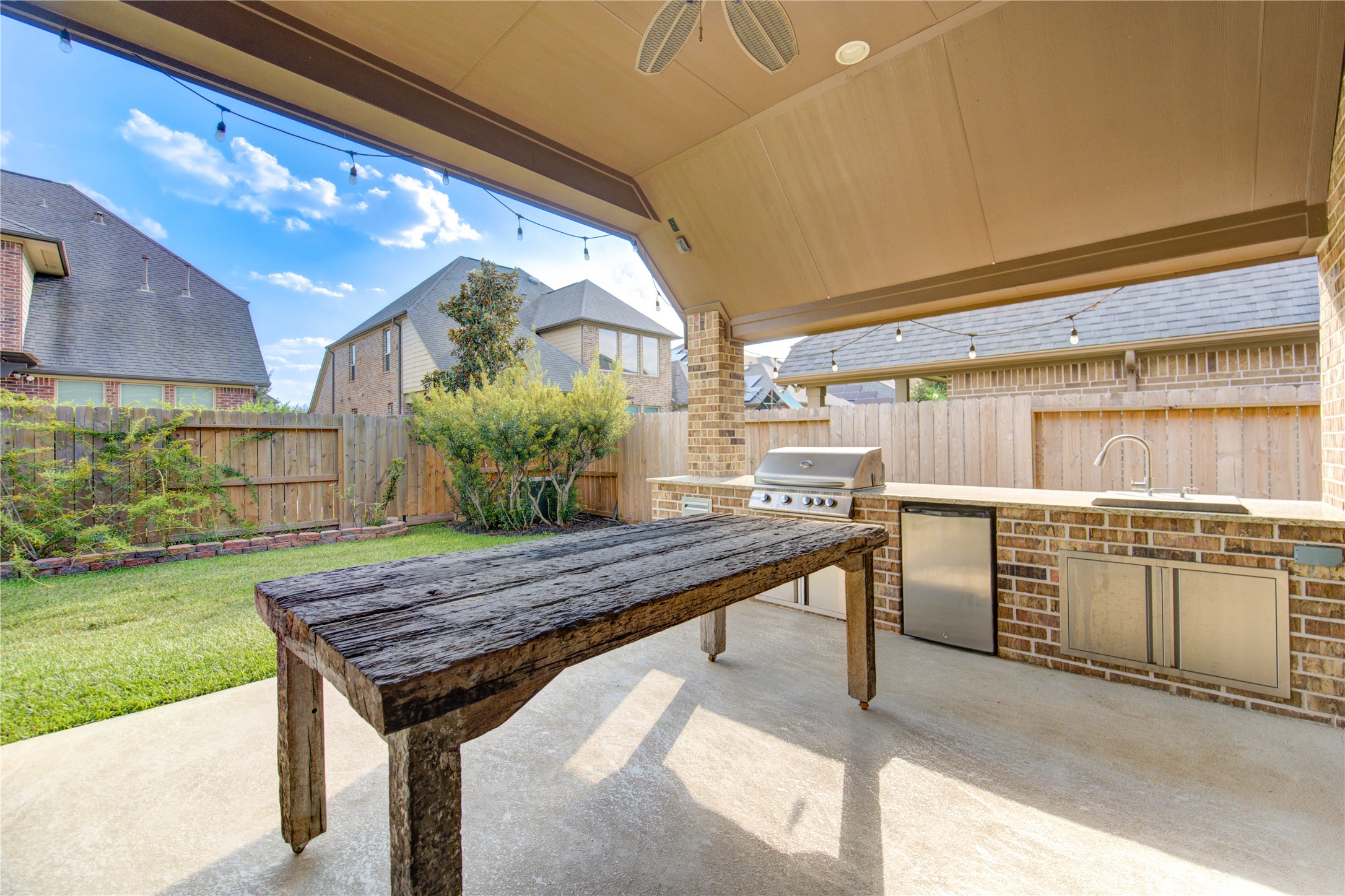 29103 Erica Lee Court Katy, TX 77494 - Photo 42 of 49 a kitchen with a stove and a wooden cabinets