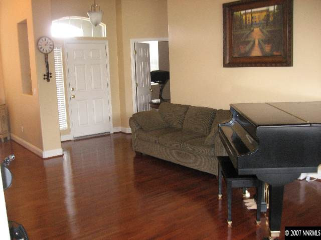 10661 Copper Moon Court Reno, NV 89521 - Photo 5 of 9 a living room with furniture and a wooden floor