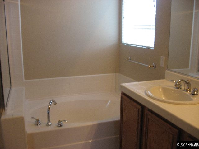 10661 Copper Moon Court Reno, NV 89521 - Photo 7 of 9 a bathroom with a sink and a bathtub