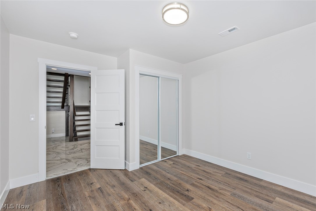 20601 Shelburne Road Shaker Heights, OH 44122 - Photo 27 of 29 First level bedroom featuring wood finished floors and a closet