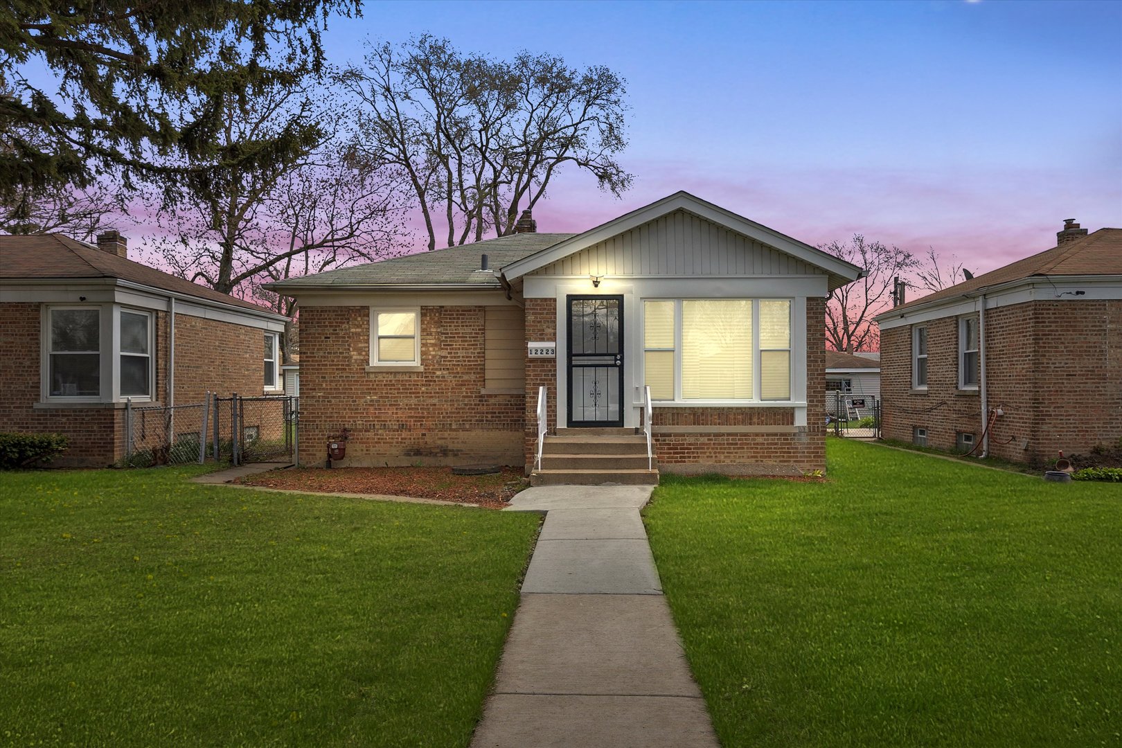 12223 South Ada Street Chicago, IL 60643 - Photo 1 of 22 a front view of a house with a garden and yard