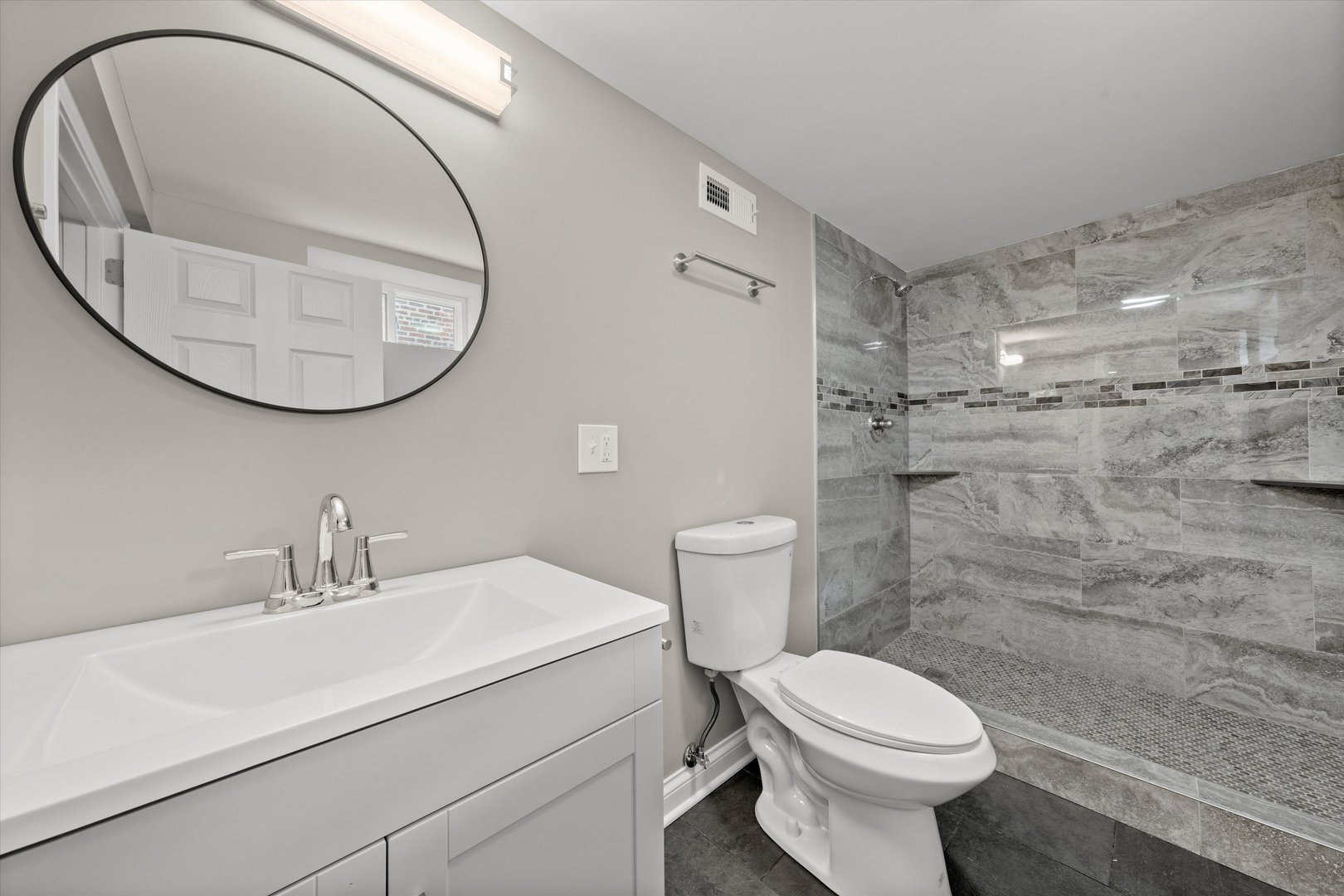 12223 South Ada Street Chicago, IL 60643 - Photo 14 of 22 a bathroom with a sink a toilet and a mirror