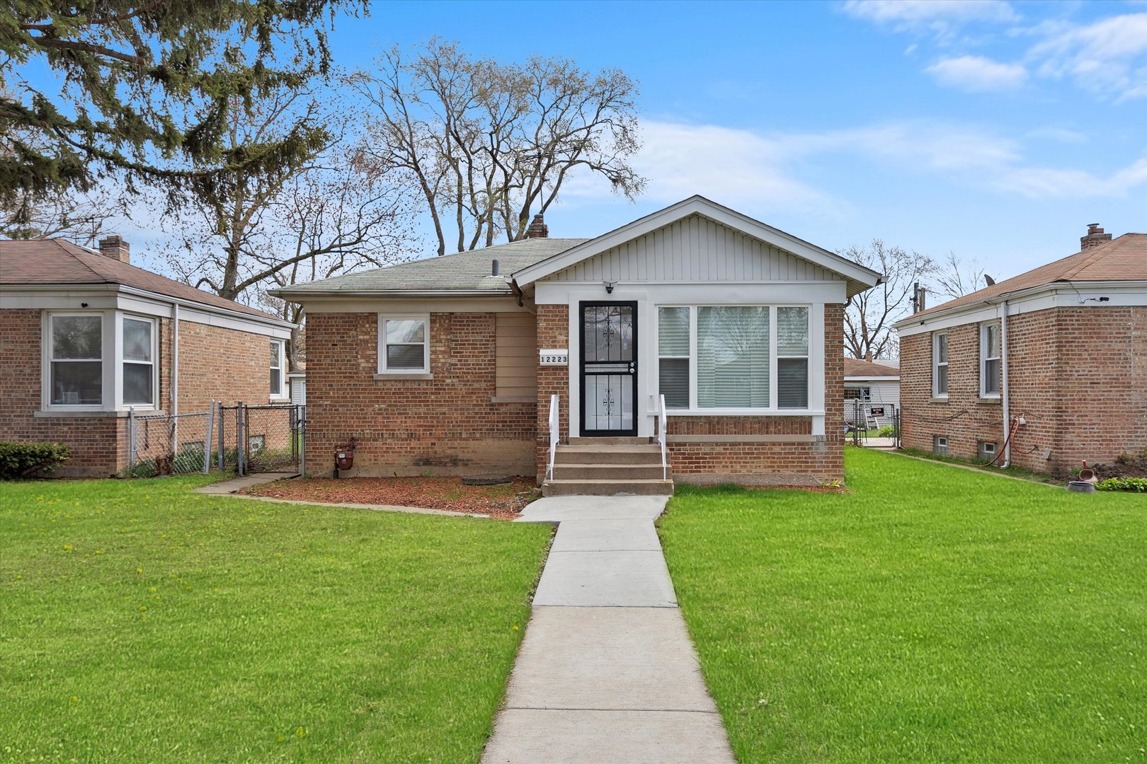 12223 South Ada Street Chicago, IL 60643 - Photo 2 of 22 a view of a house with a big yard potted plants and large tree