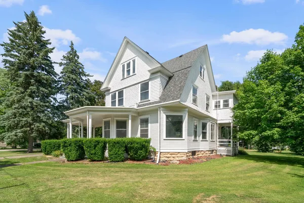 a front view of a house with a yard