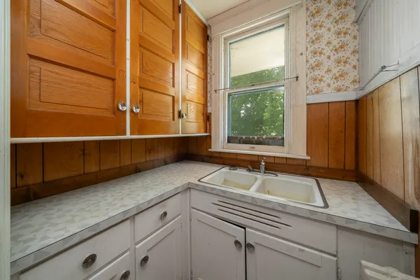 a kitchen with a sink and a window