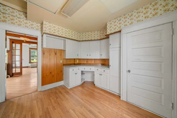 a kitchen with a refrigerator and window