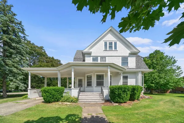 a front view of a house with a yard