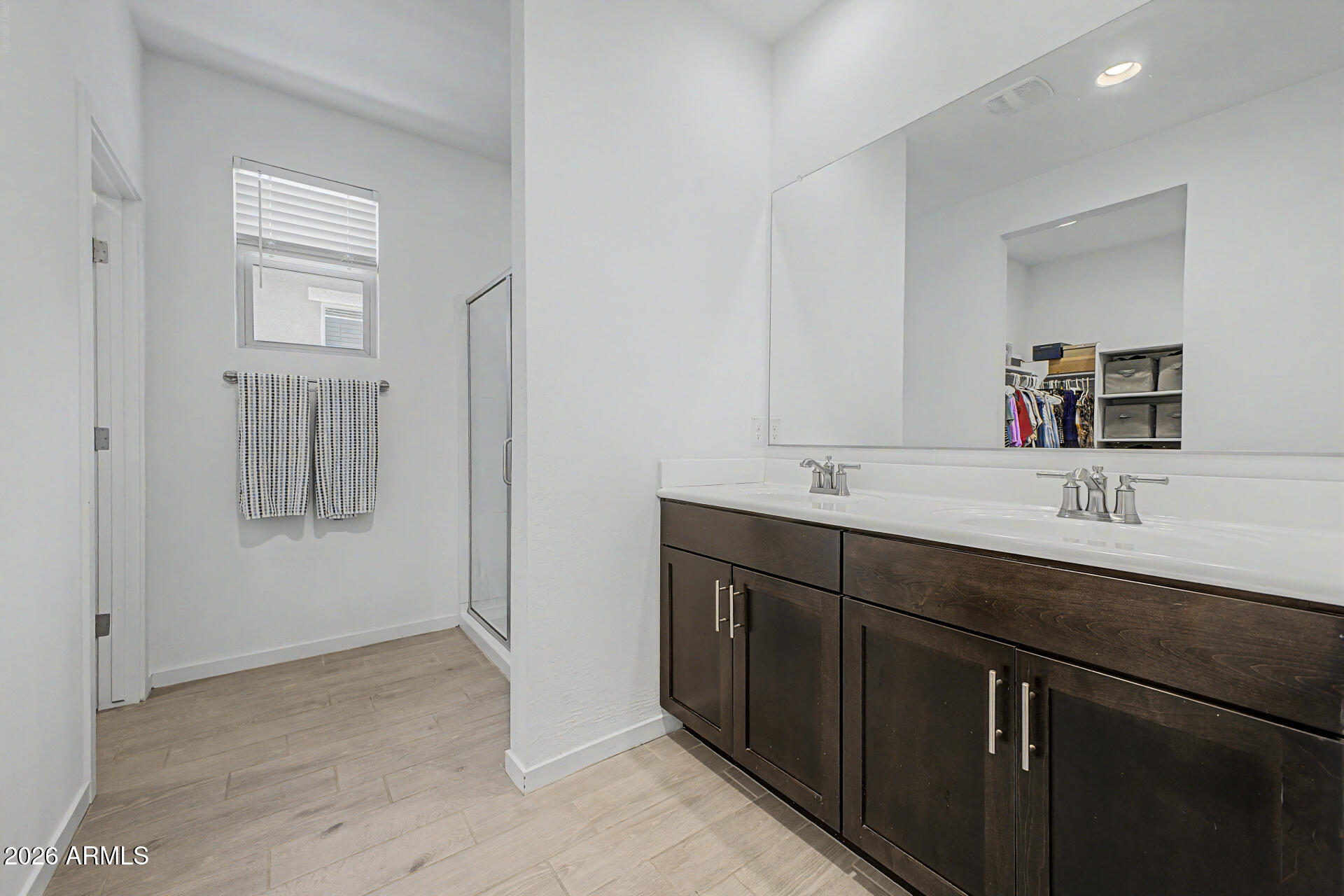 6773 West Trumbull Road Phoenix, AZ 85043 - Photo 17 of 30 a bathroom with a sink and two mirror