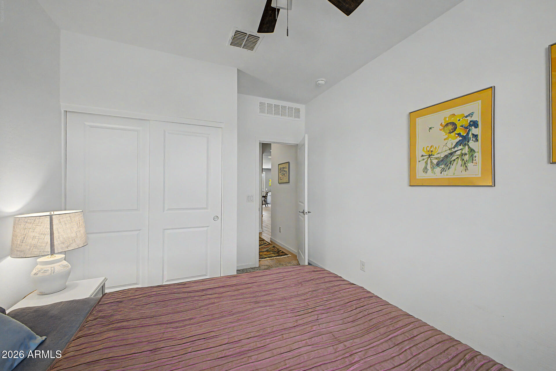 6773 West Trumbull Road Phoenix, AZ 85043 - Photo 20 of 30 a big room with wooden floor and bathroom view