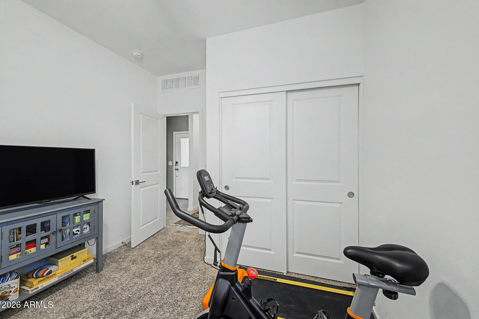 6773 West Trumbull Road Phoenix, AZ 85043 - Photo 22 of 30 a view of a room with gym equipment