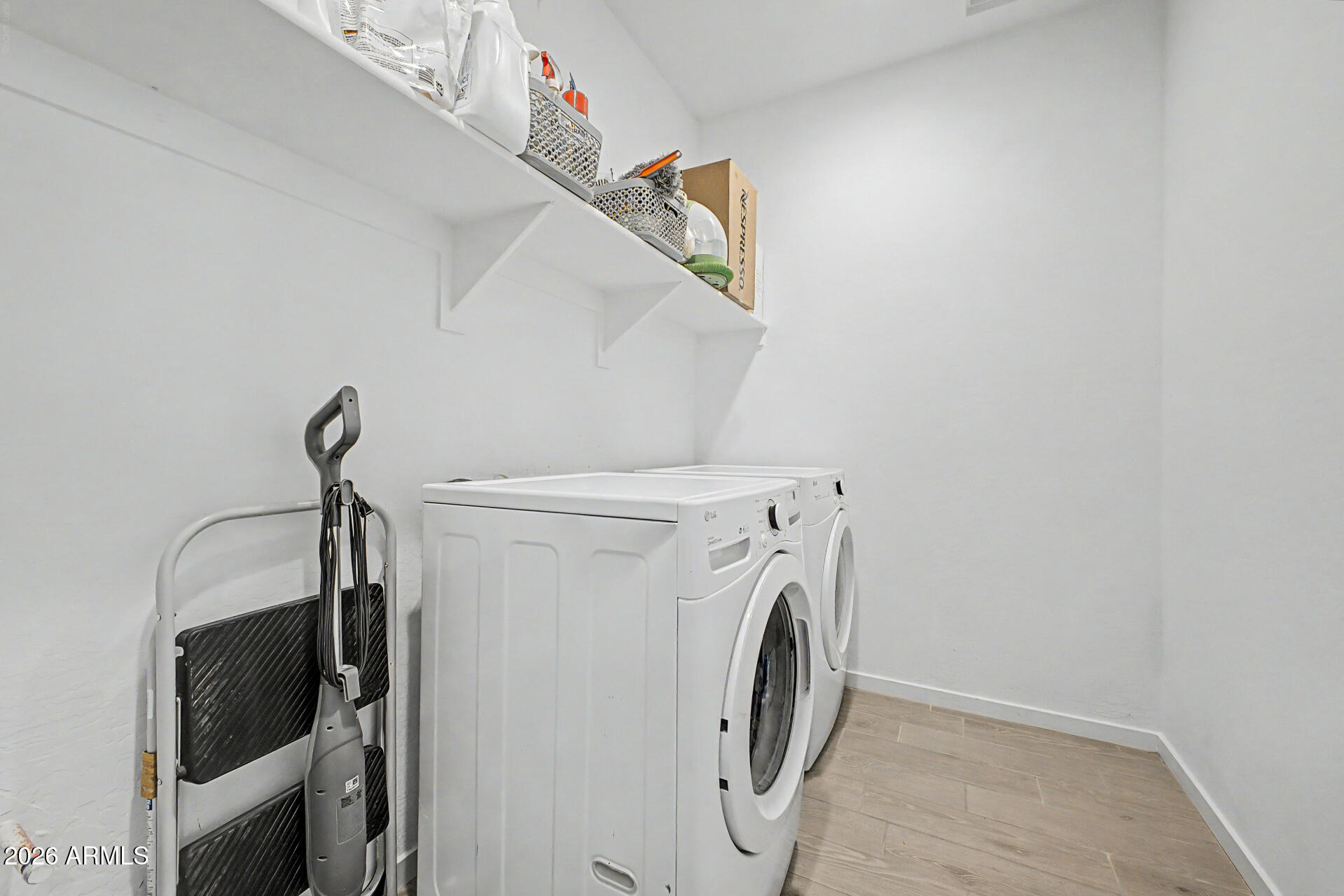 6773 West Trumbull Road Phoenix, AZ 85043 - Photo 24 of 30 a utility room with dryer and washer