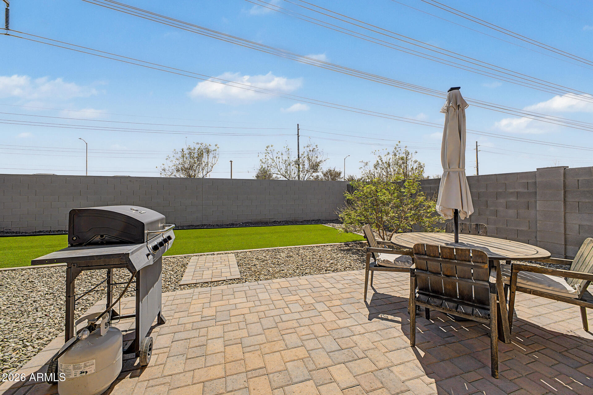 6773 West Trumbull Road Phoenix, AZ 85043 - Photo 26 of 30 a patio with table and chairs