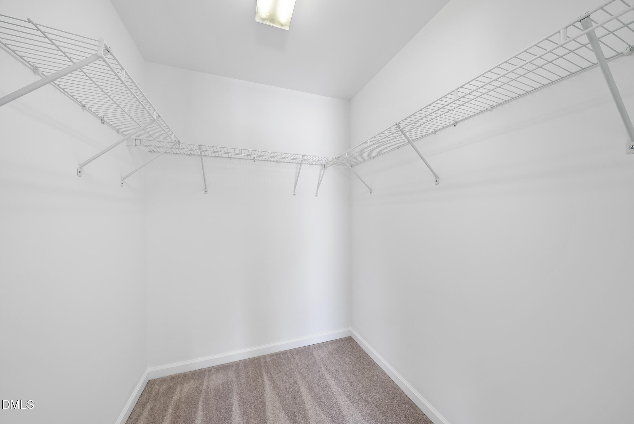 2211 Raven Road, Unit 102 Raleigh, NC 27614 - Photo 16 of 30 a view of a room with racks on the wall