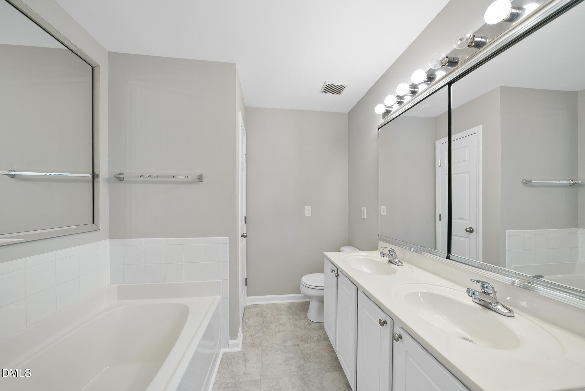 2211 Raven Road, Unit 102 Raleigh, NC 27614 - Photo 17 of 30 a bathroom with a tub sink and mirror