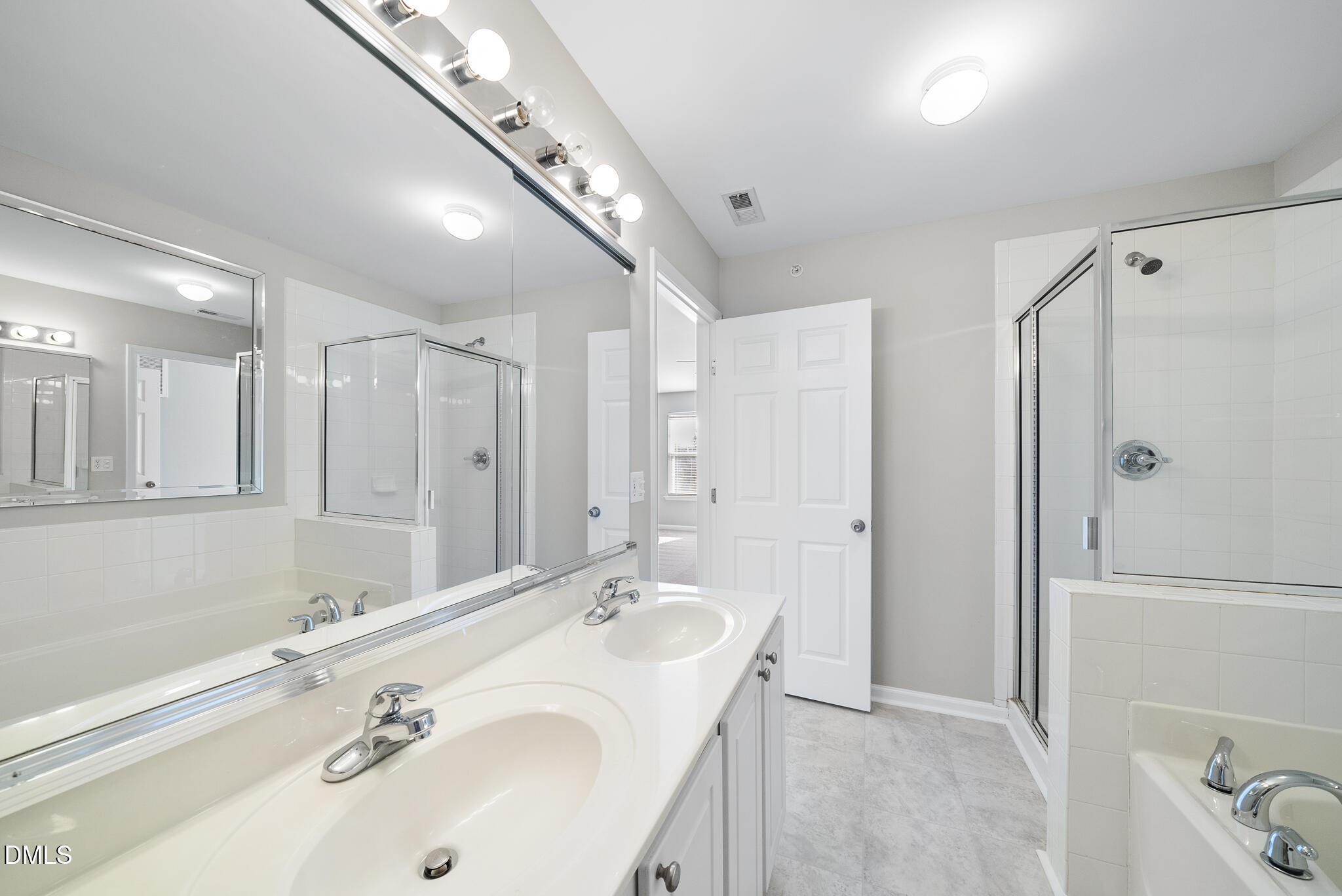 2211 Raven Road, Unit 102 Raleigh, NC 27614 - Photo 18 of 30 a bathroom with a sink and a mirror