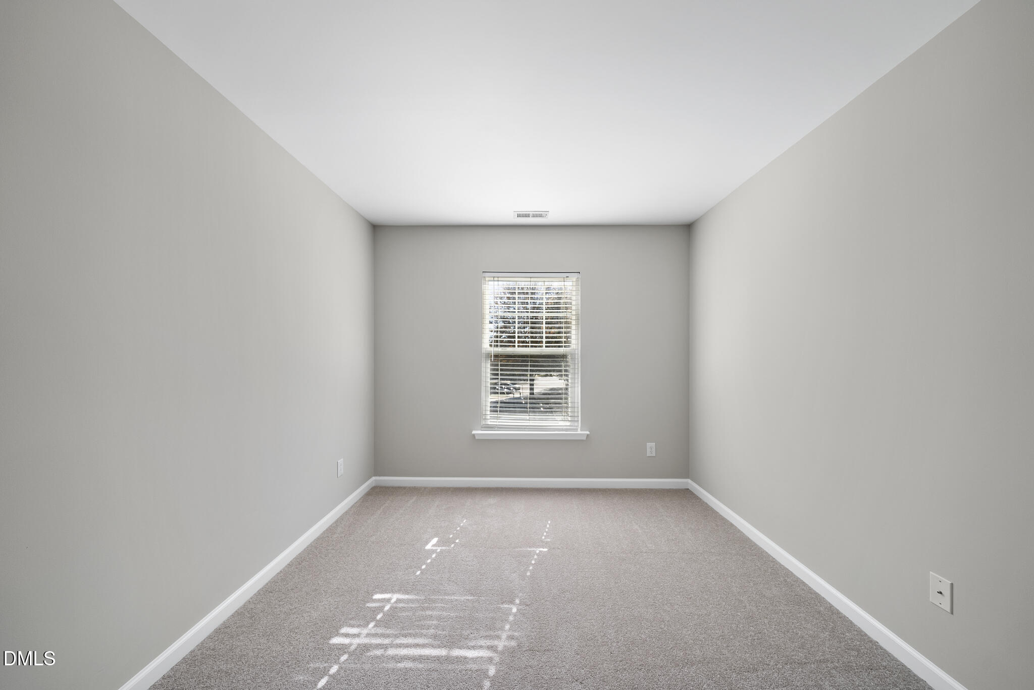 2211 Raven Road, Unit 102 Raleigh, NC 27614 - Photo 20 of 30 a view of an empty room with a window