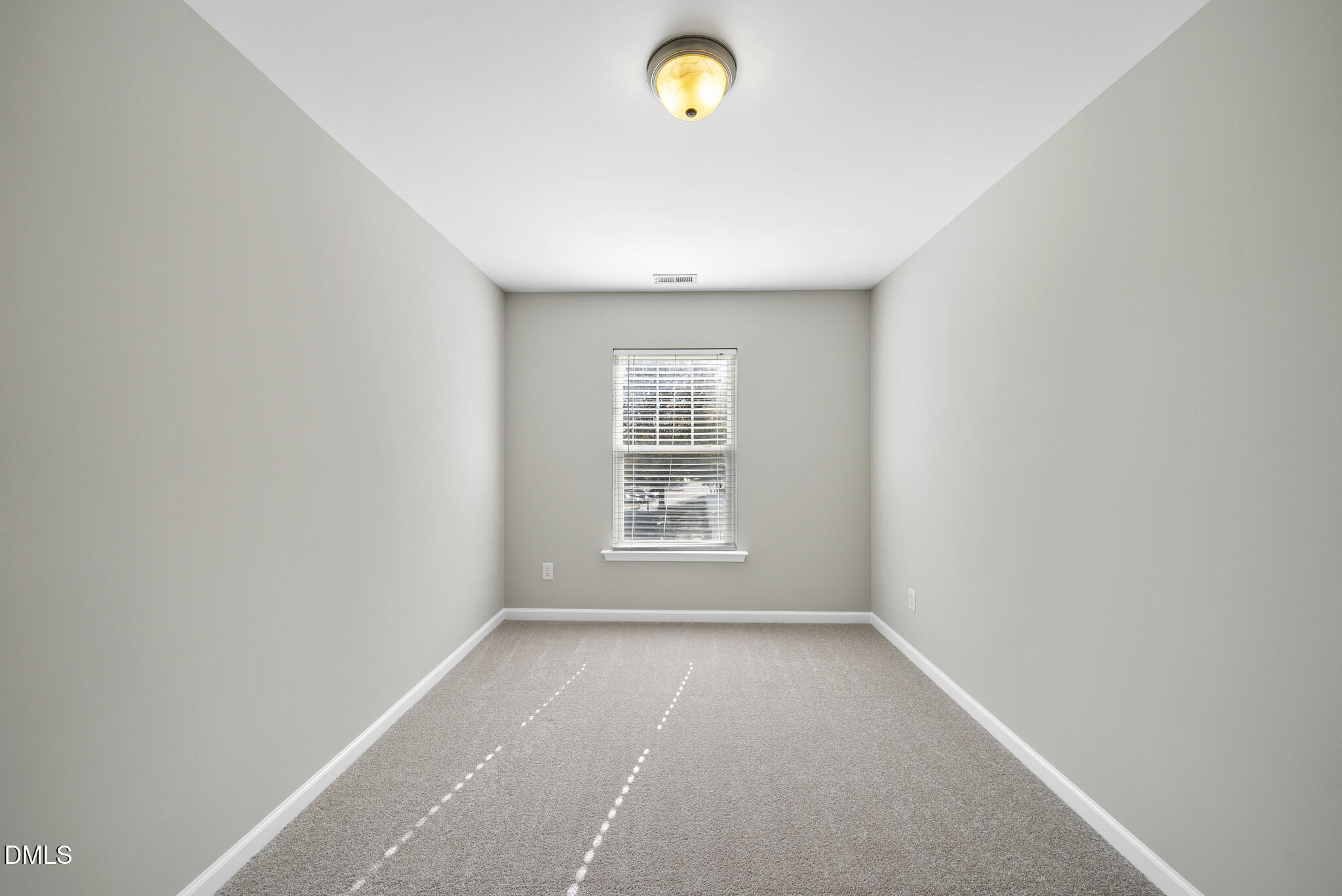 2211 Raven Road, Unit 102 Raleigh, NC 27614 - Photo 22 of 30 a view of an empty room with a window