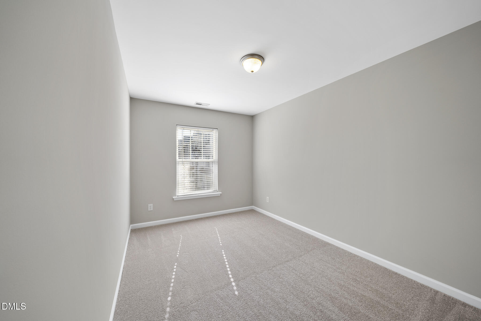 2211 Raven Road, Unit 102 Raleigh, NC 27614 - Photo 23 of 30 a view of an empty room with a window