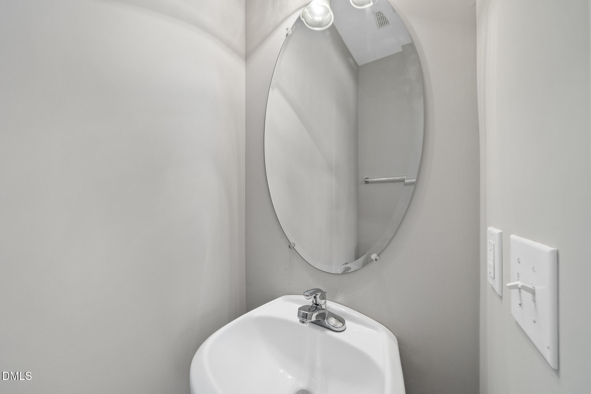 2211 Raven Road, Unit 102 Raleigh, NC 27614 - Photo 26 of 30 a bathroom with a sink and mirror