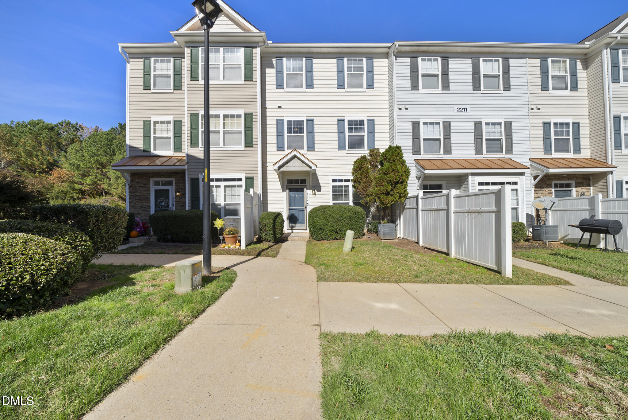2211 Raven Road, Unit 102 Raleigh, NC 27614 - Photo 2 of 30 a front view of a house with garden and porch
