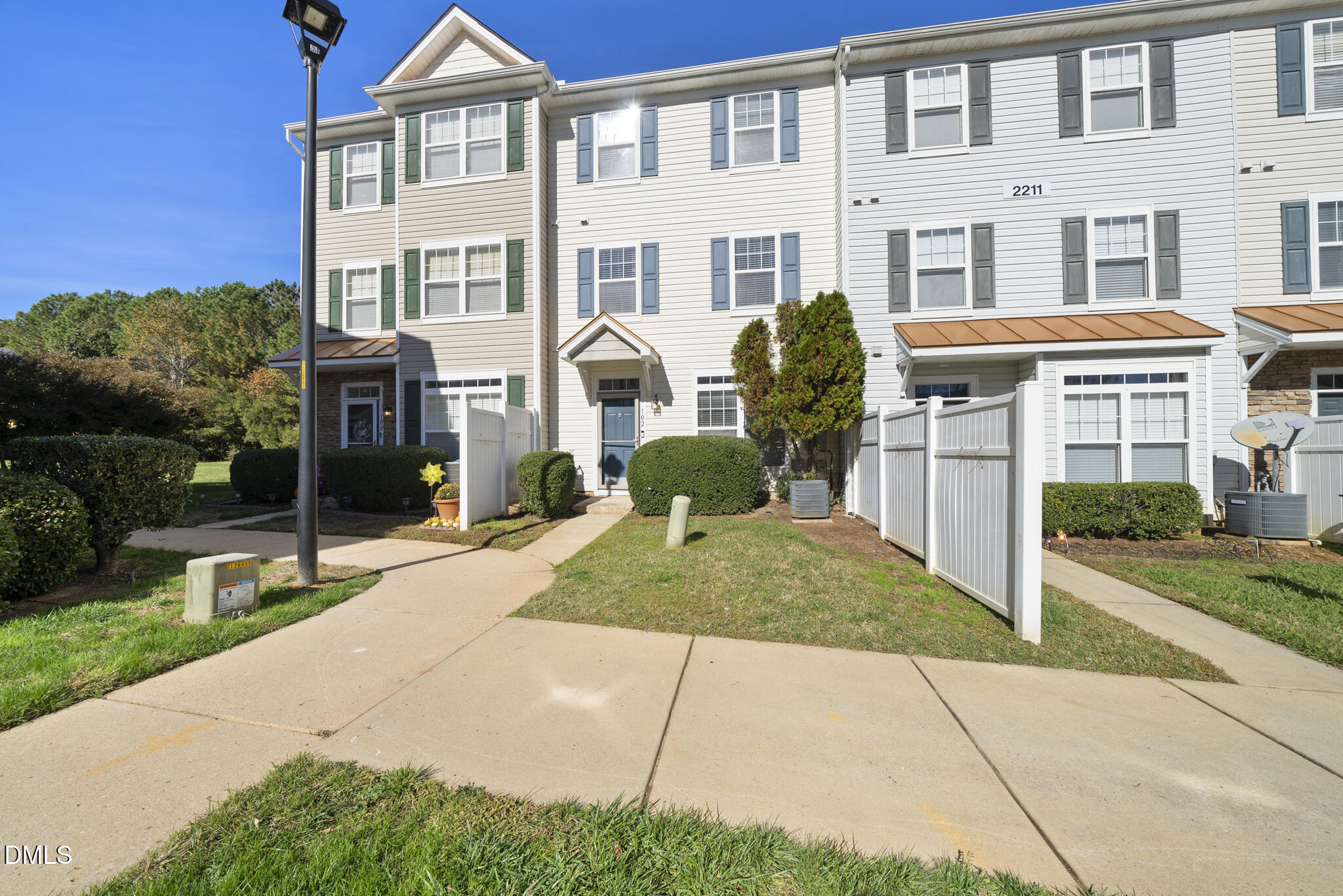 2211 Raven Road, Unit 102 Raleigh, NC 27614 - Photo 3 of 30 a front view of a house with garden