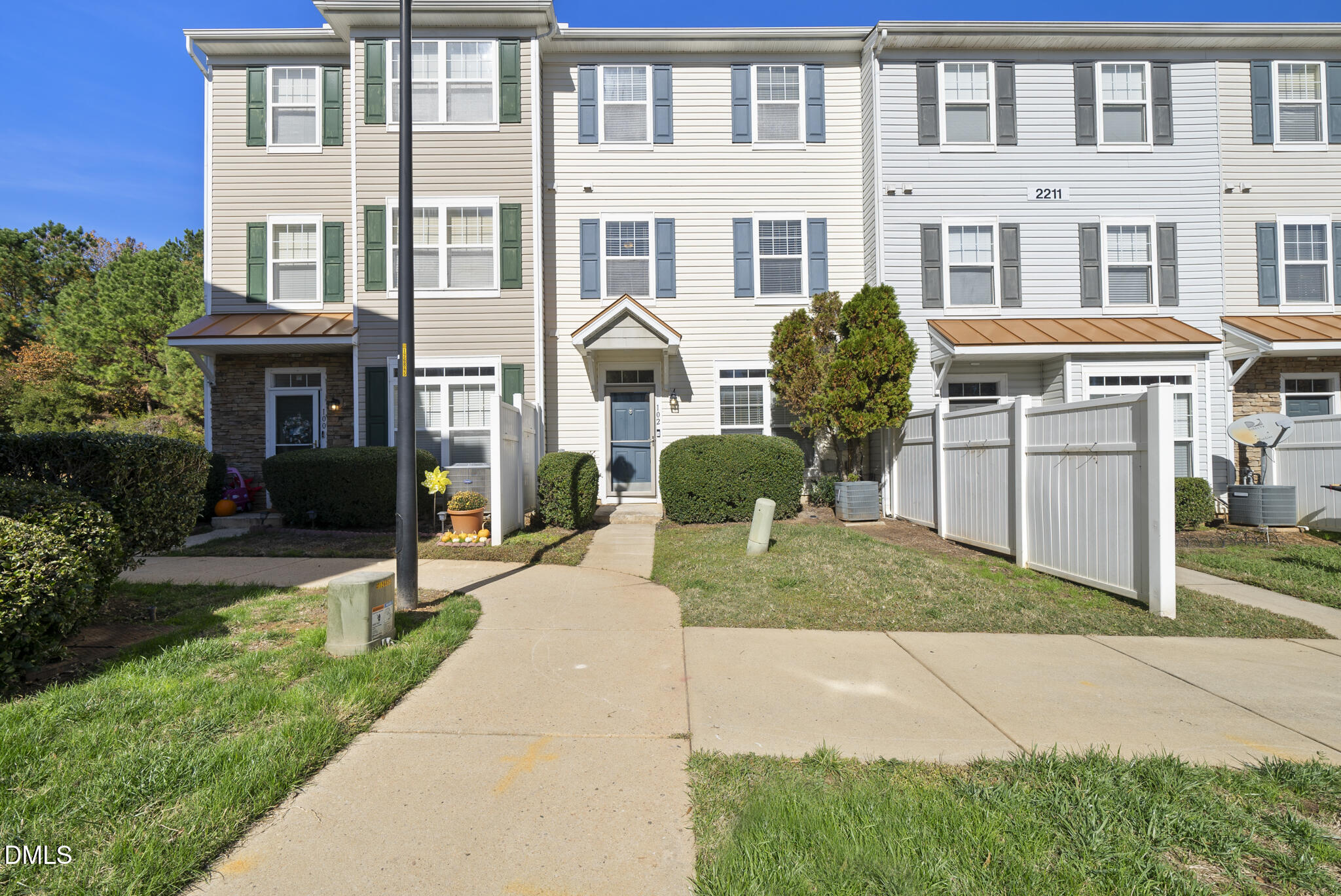 2211 Raven Road, Unit 102 Raleigh, NC 27614 - Photo 4 of 30 a front view of a house with a yard