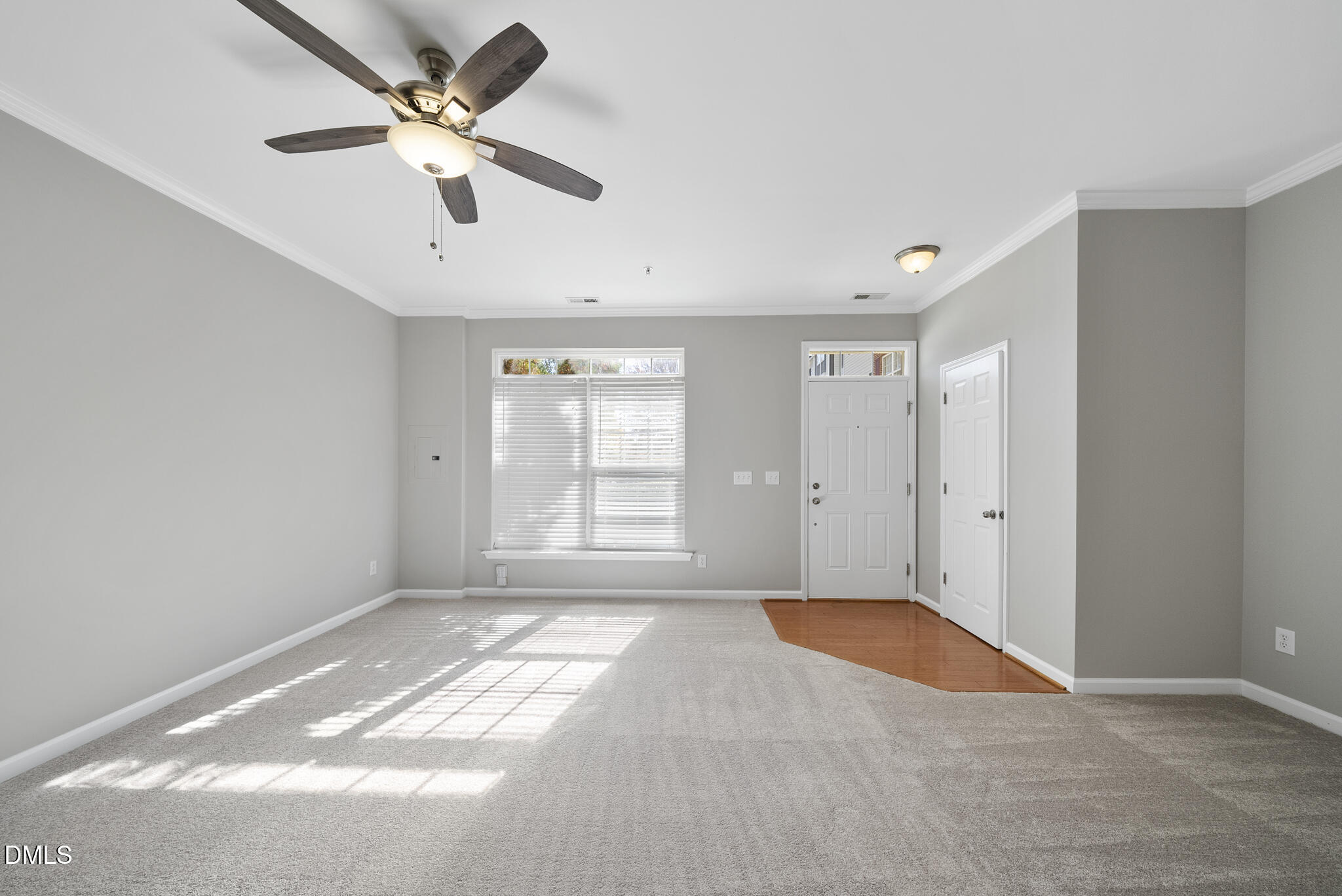 2211 Raven Road, Unit 102 Raleigh, NC 27614 - Photo 5 of 30 a view of a big room with windows and ceiling fan