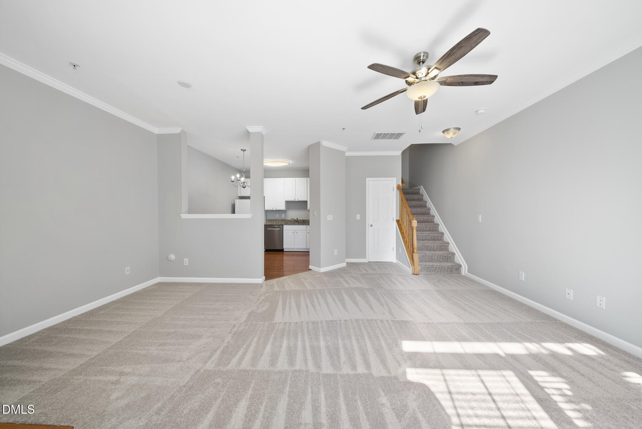 2211 Raven Road, Unit 102 Raleigh, NC 27614 - Photo 6 of 30 a view of empty room with wooden floor and ceiling fan