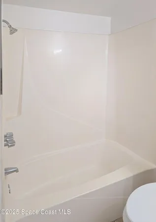 a close up of a bathtub in a bathroom