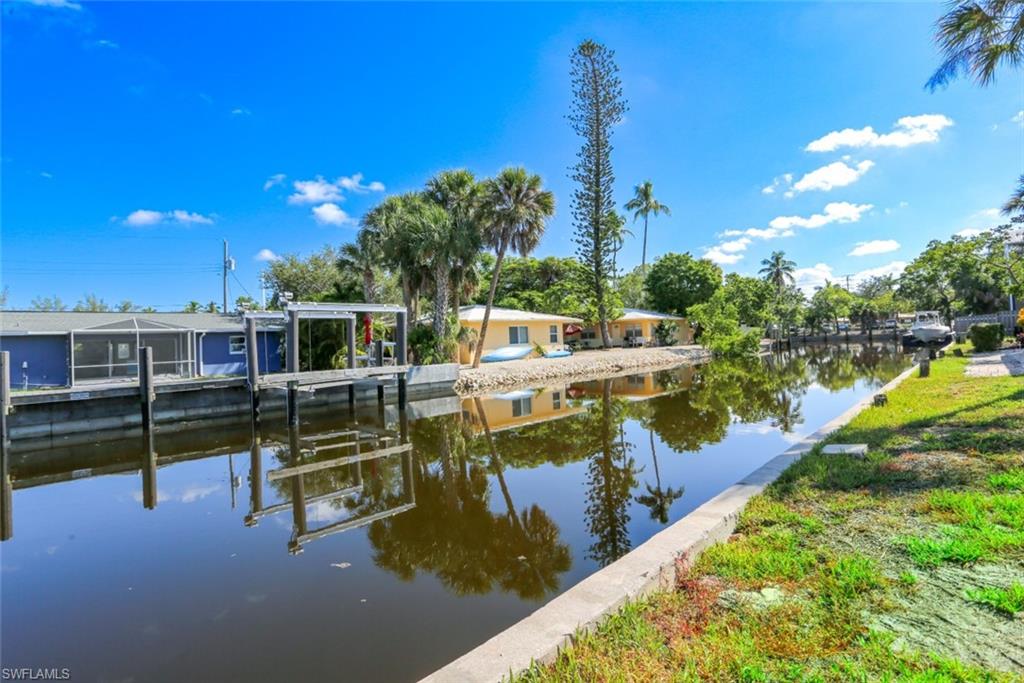 2777 Shoreview Drive, Unit 2 Naples, FL 34112 - Photo 3 of 8 View of dock featuring a water view