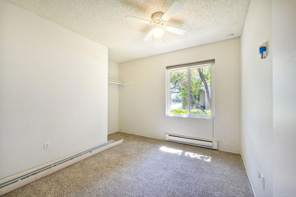 8741 Wahl Street Santee, CA 92071 - Photo 17 of 30 an empty room with windows and fan