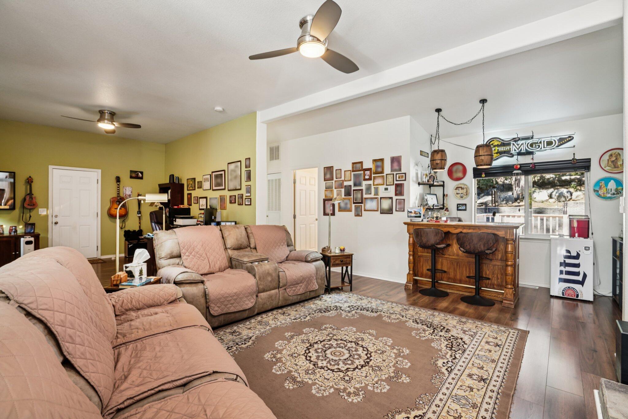 25001 Rim Rock Road Idyllwild, CA 92549 - Photo 12 of 49 a living room with furniture and a wooden floor