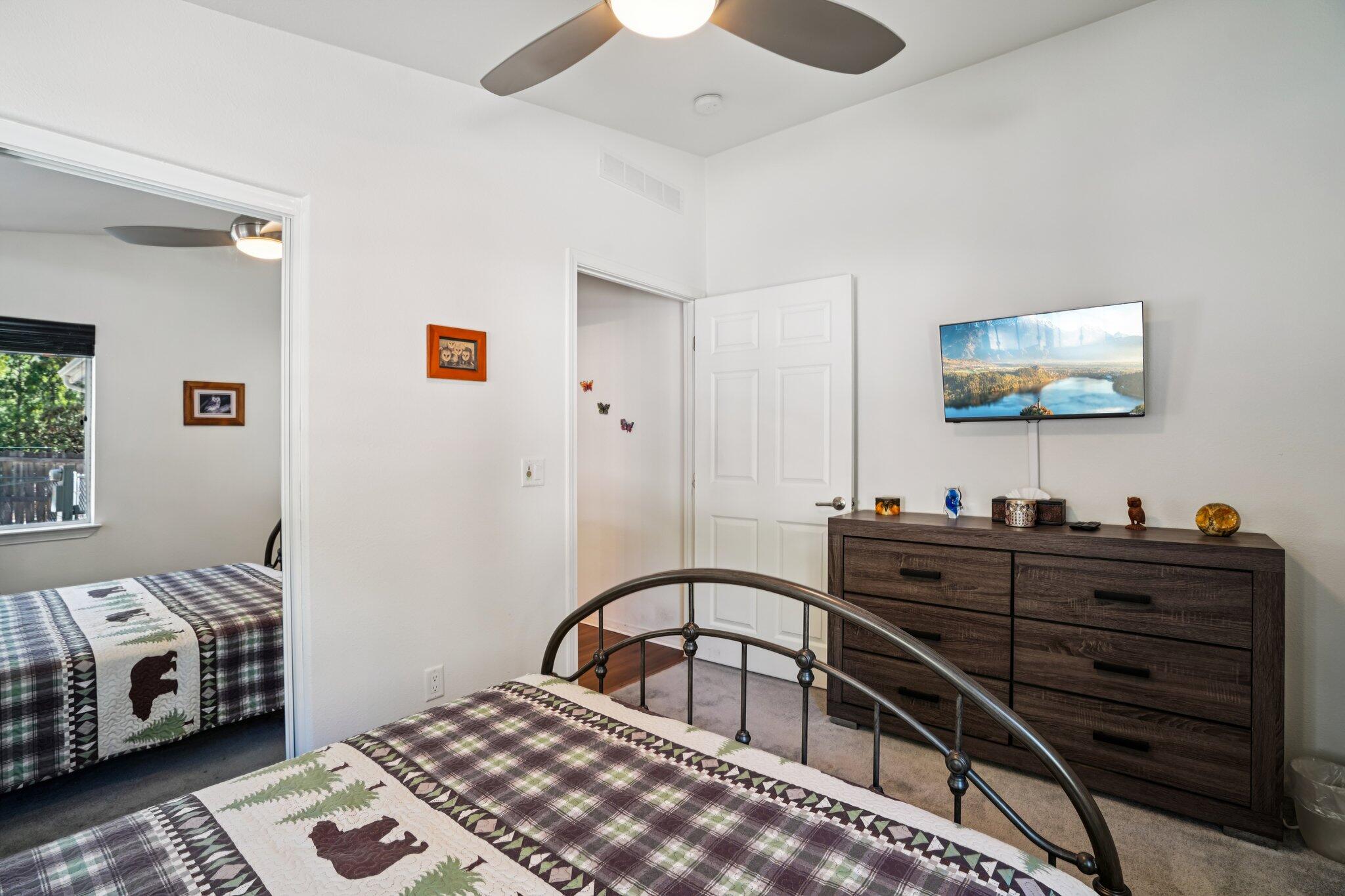 25001 Rim Rock Road Idyllwild, CA 92549 - Photo 37 of 49 a bedroom with furniture and flat screen tv