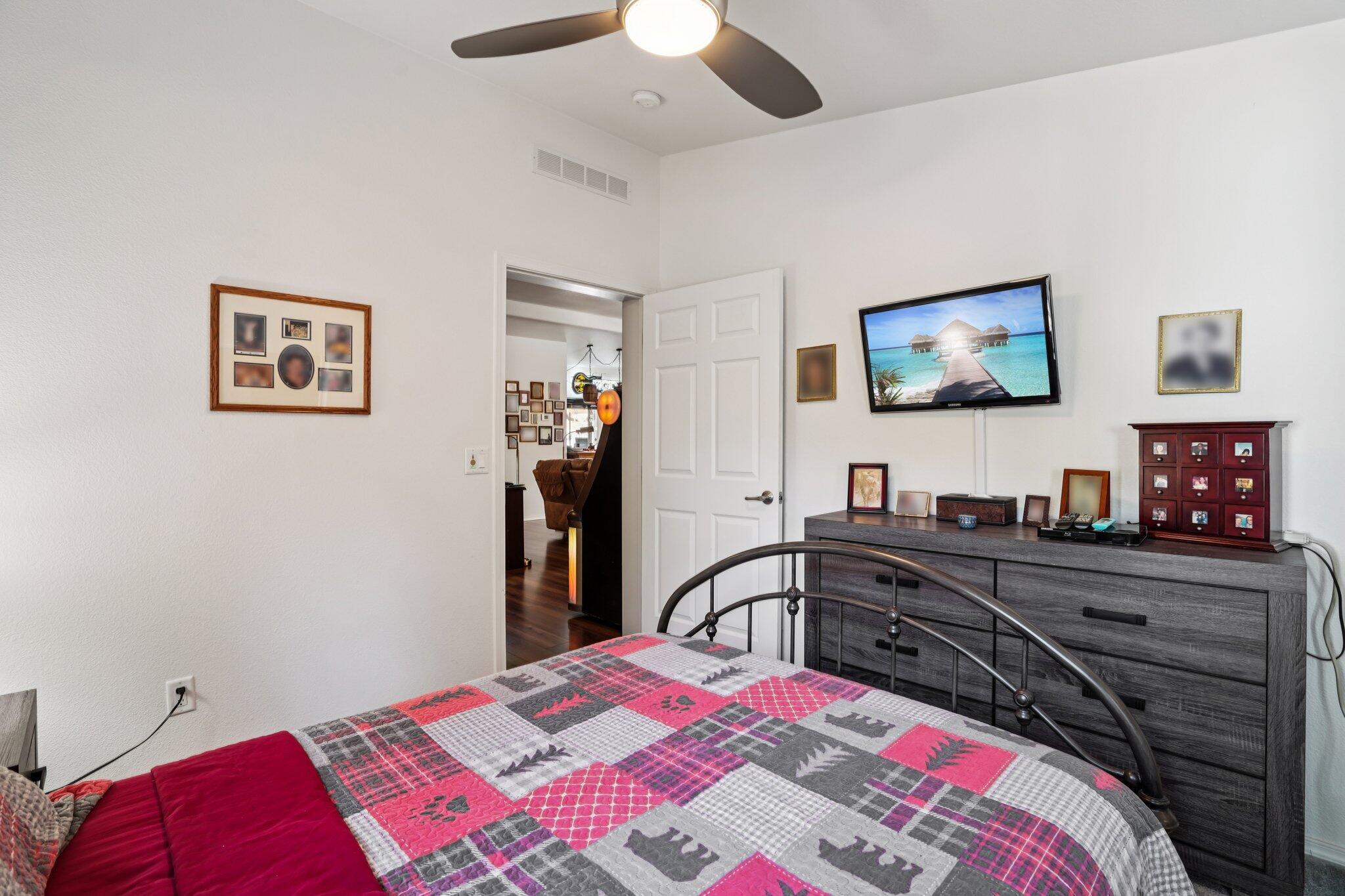 25001 Rim Rock Road Idyllwild, CA 92549 - Photo 40 of 49 a bedroom with a bed and a flat screen tv