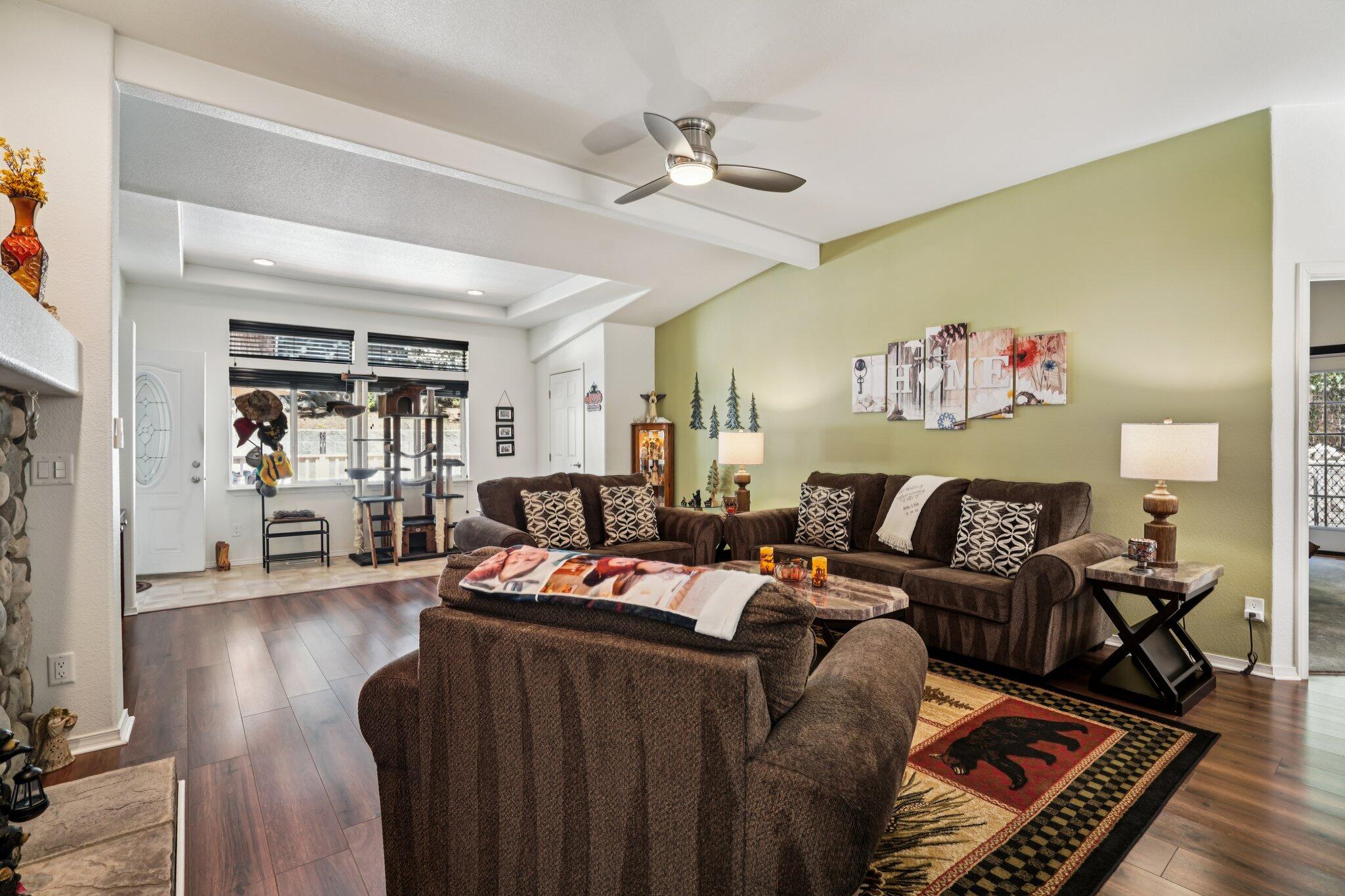 25001 Rim Rock Road Idyllwild, CA 92549 - Photo 7 of 49 a living room with furniture ceiling fan and a rug
