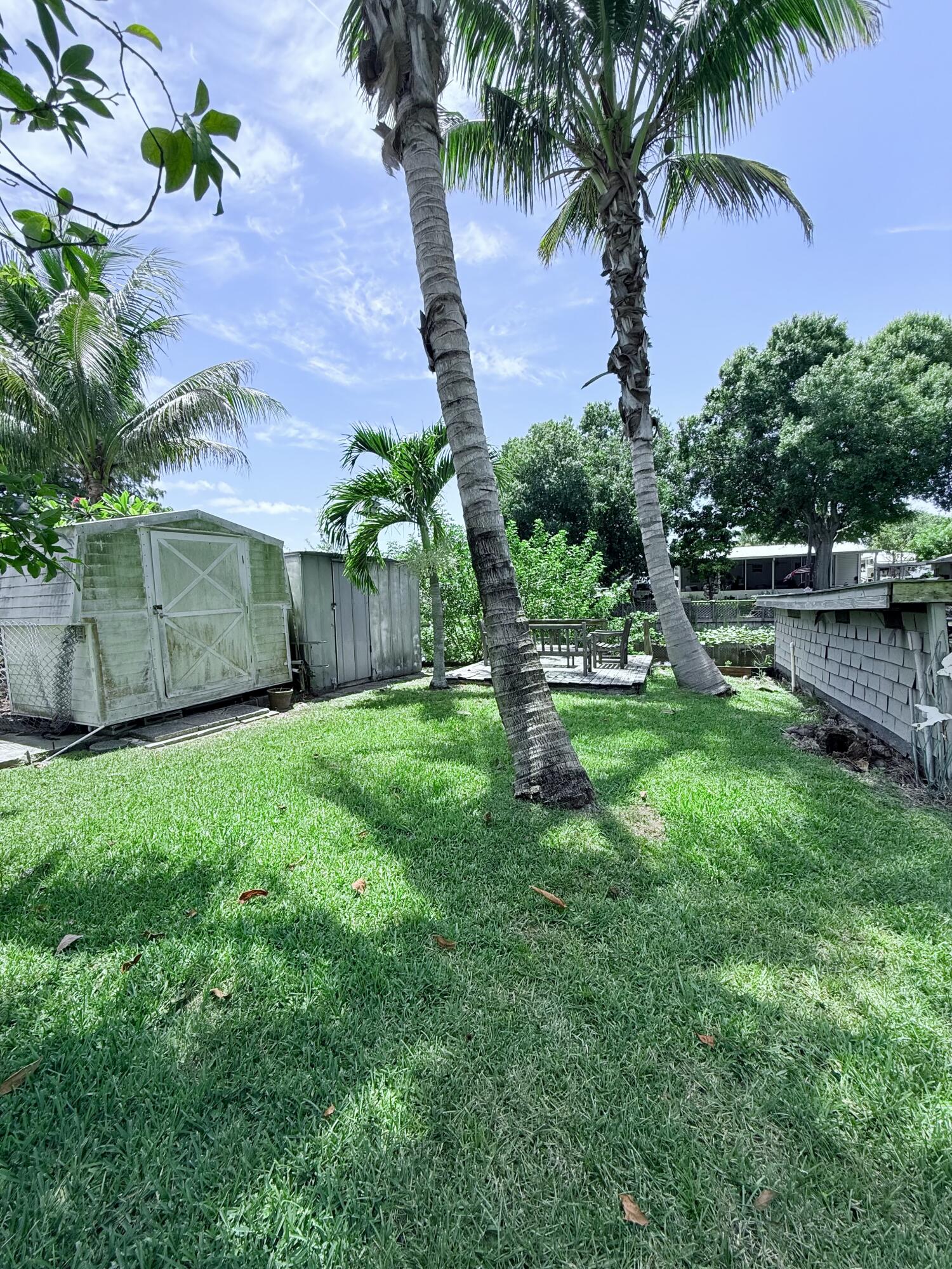 1736 Hunter Road Okeechobee, FL 34974 - Photo 31 of 35 a view of a backyard with a garden