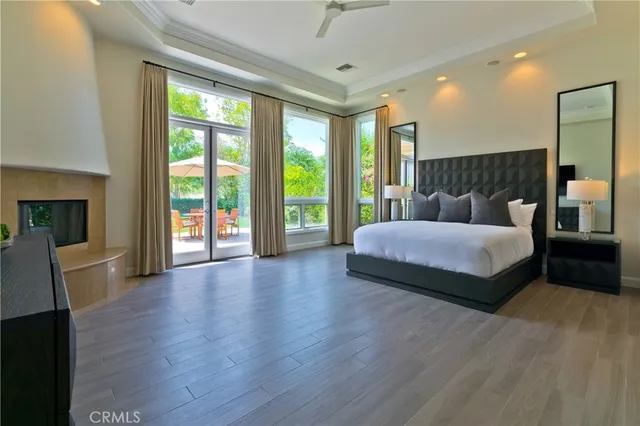 a spacious bedroom with a large bed and a large window