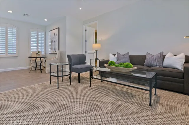 a living room with furniture and a rug
