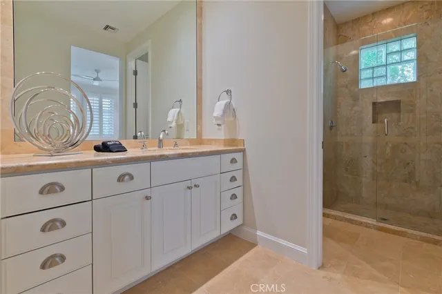 a bathroom with a sink a vanity and a mirror