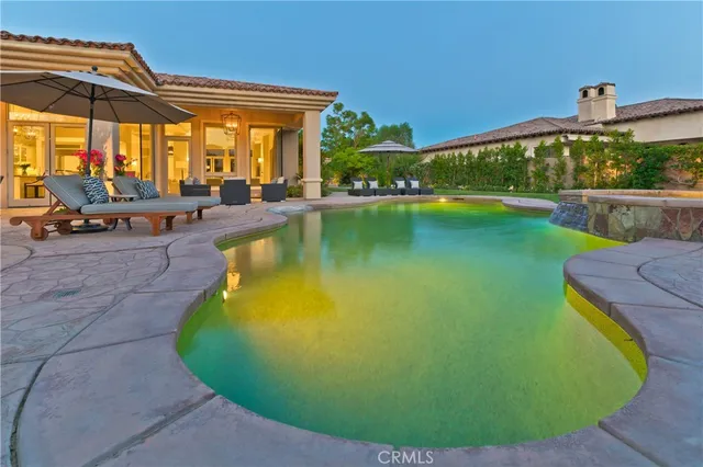 a view of a swimming pool with a patio