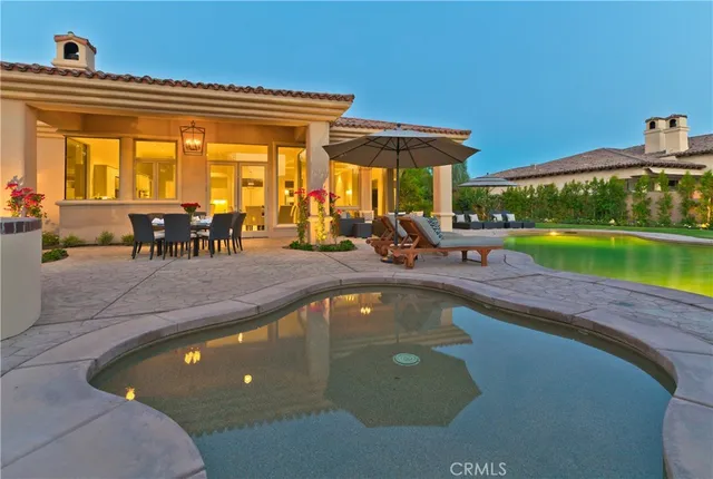 a view of a swimming pool with a lounge chair