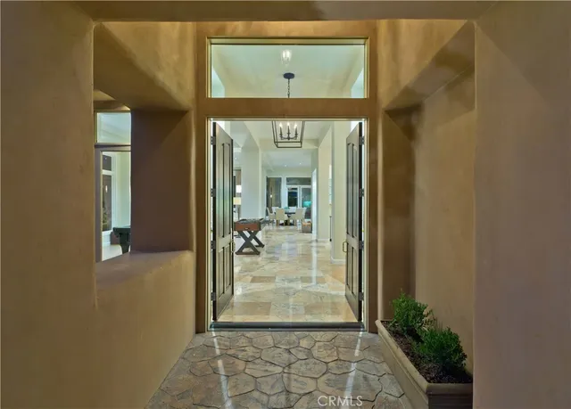 an aerial view of residential house with outdoor space and mountain view