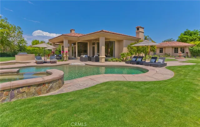a view of a house with potted plants