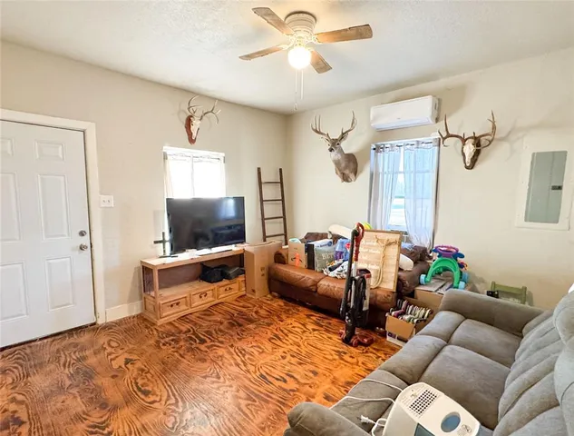 a bedroom with a bed and chair