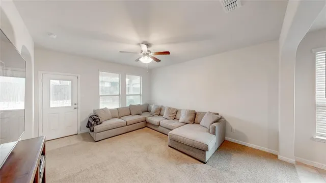 a living room with furniture and a window