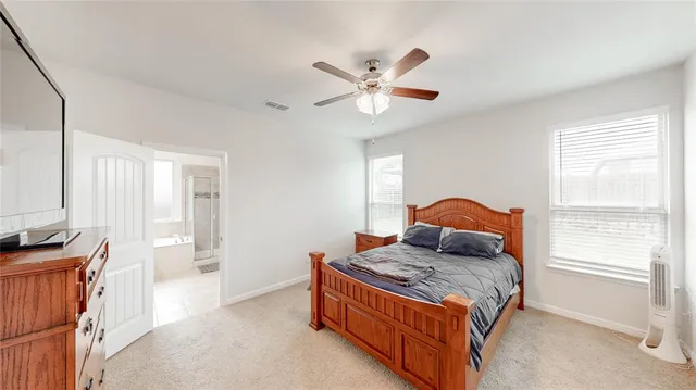 a living room with a bed and a window