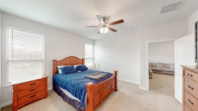 a bedroom with a bed and a cabinets