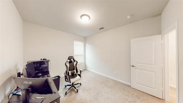 a view of room with gym equipment