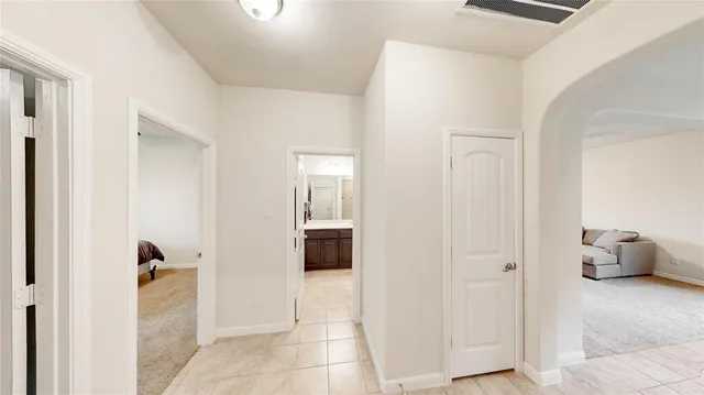a bathroom with a tub shower and a sink