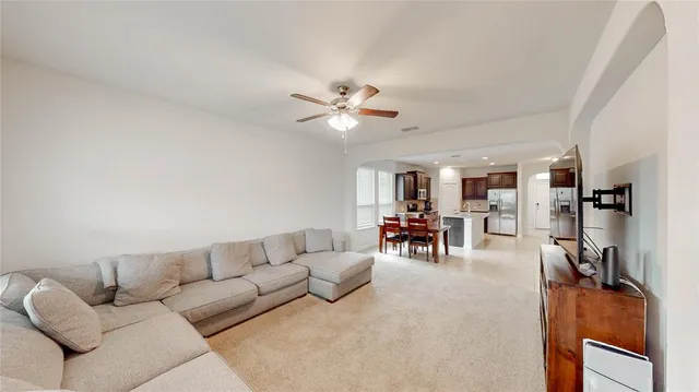 a living room with furniture and a table